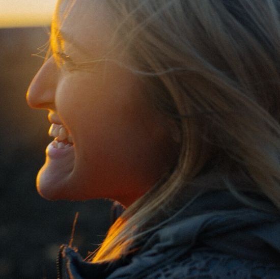 Smiling womans face in the sun