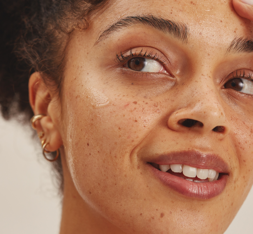 Woman model with Dermatica Hydrating Hyaluronic Acid + Vit B5 Serum on her face