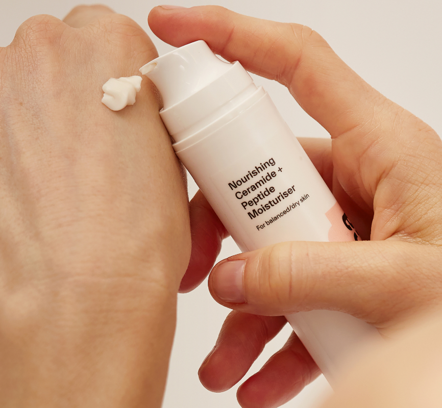 Model using Dermatica Nourishing Ceramide + Peptide Moisturizer